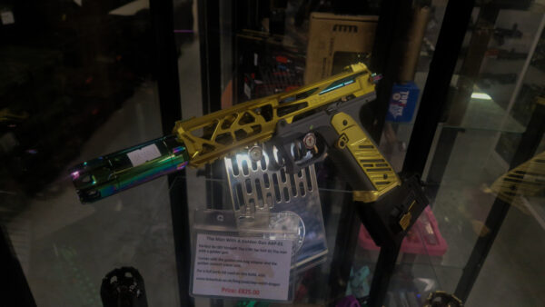 a custom built airsoft AAP-01 by CTM TAC on a display case